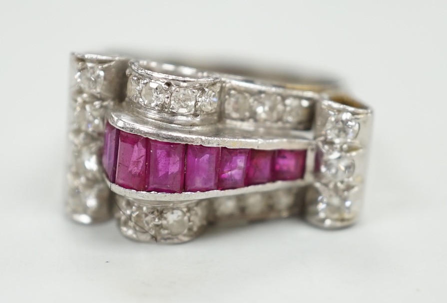 A 1950's? white metal, graduated ruby and diamond cluster set cocktail ring, size Q, gross weight 9.1 grams.
